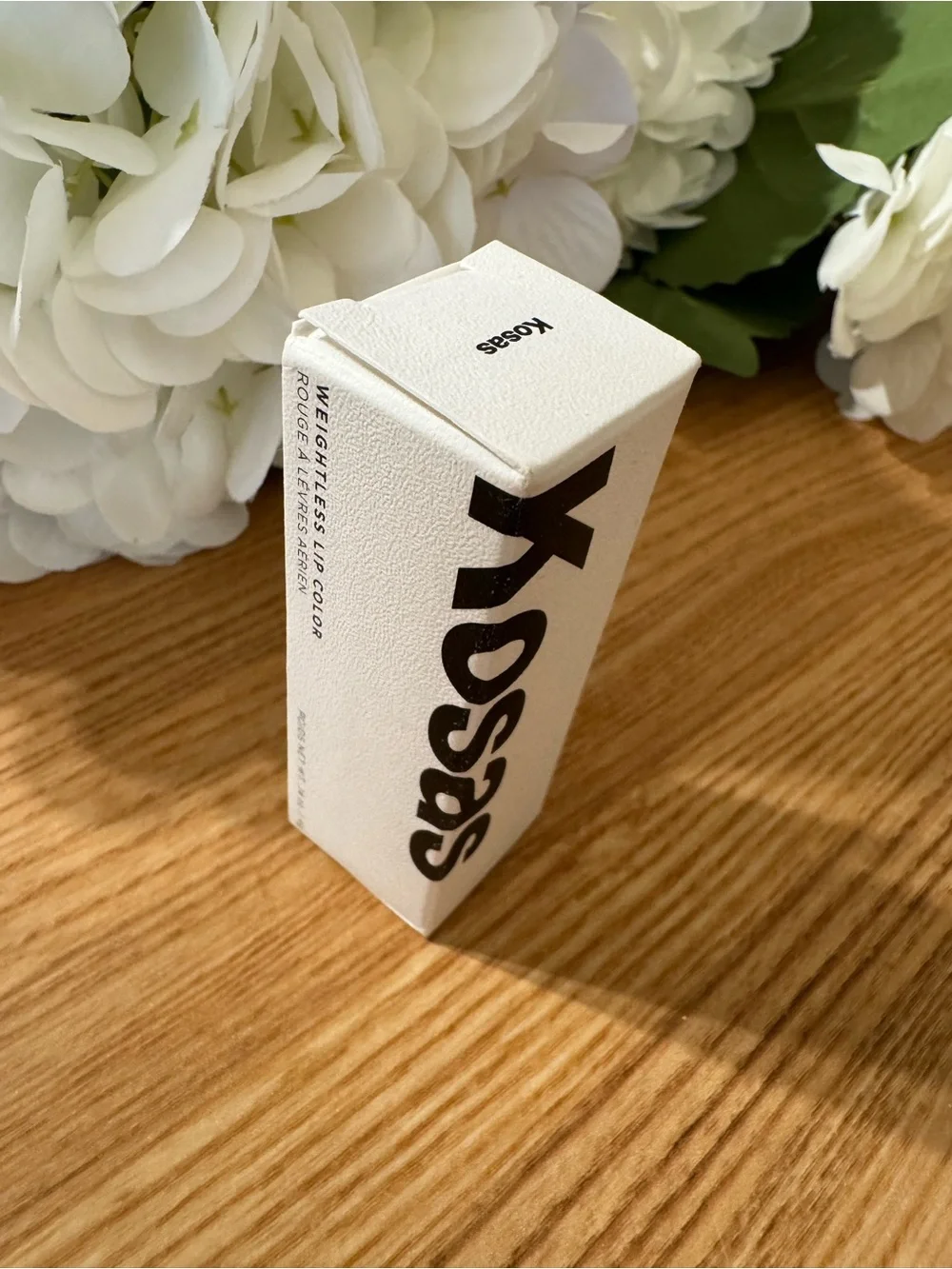 Kosas White Packaging with Black Logo Weightless lip color Darkroom Beauty